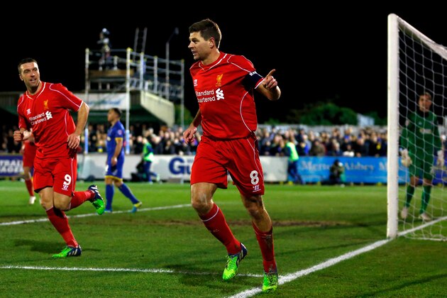 KINGSTON UPON THAMES, ENGLAND - JANUARY 05:  Steven Gerrard of Liverpool celebrates after scoring the opening goal with a header during the FA Cup Third Round match between AFC Wimbledon and Liverpool at The Cherry Red Records Stadium on January 5, 2015 in Kingston upon Thames, England.  (Photo by Julian Finney/Getty Images)