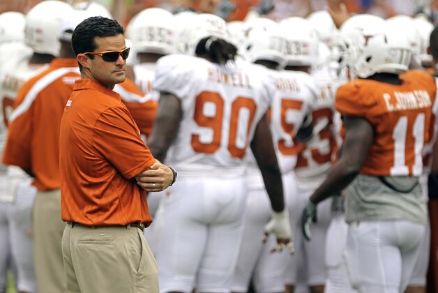 Texas' new defensive coordinator Manny Diaz looks on before  the Texas Orange and White spring football scrimmage on April 3, 2011, in Austin, Texas. The Orange team won 27-7. (AP Photo/Michael Thomas)