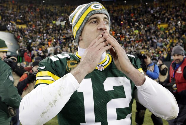 Green Bay Packers' Aaron Rodgers acknowledges the crowd after an NFL football game against the Detroit Lions Sunday, Dec. 28, 2014, in Green Bay, Wis. The Packers won 30-20. (AP Photo/Jim Slosiarek)