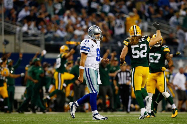 ARLINGTON, TX - DECEMBER 15:  Quarterback Tony Romo #9 of the Dallas Cowboys walks off the field after losing 37-36 to the Green Bay Packers during a game at AT&T Stadium on December 15, 2013 in Arlington, Texas.  (Photo by Tom Pennington/Getty Images)