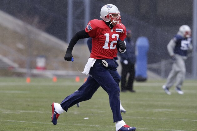 New England Patriots quarterback Tom Brady runs a drill during an NFL football practice in Foxborough, Mass., Tuesday, Jan. 6, 2015.  The Patriots face the Baltimore Ravens in a divisional playoff on Saturday. (AP Photo/Charles Krupa)