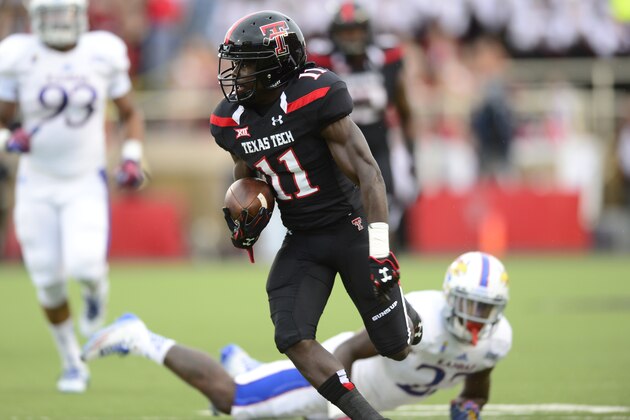 LUBBOCK, TX - OCTOBER 18: Jakeem Grant #11 of the Texas Tech Red Raiders  carries the ball against the Kansas Jayhawks on October 18, 2014 at Jones AT&T Stadium in Lubbock, Texas. Texas Tech won the game 34-21.(Photo by John Weast/Getty Images)