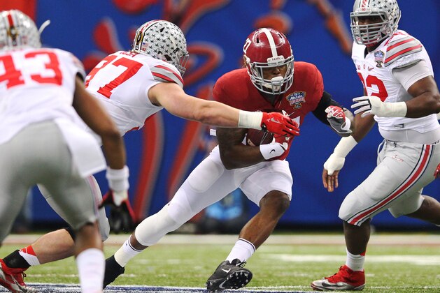 Jan 1, 2015; New Orleans, LA, USA; Alabama Crimson Tide running back Derrick Henry (27) carries the ball as Ohio State Buckeyes defensive lineman Joey Bosa (97) pursues in the first quarter of the 2015 Sugar Bowl at Mercedes-Benz Superdome. Mandatory Credit: Crystal LoGiudice-USA TODAY Sports