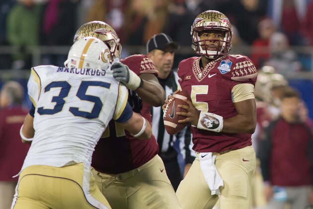 Dec 6, 2014; Charlotte, NC, USA; Florida State Seminoles quarterback Jameis Winston (5) looks to pass the ball during the third quarter against the Georgia Tech Yellow Jackets at Bank of America Stadium. FSU defeated Georgia Tech 37-35. Mandatory Credit: Jeremy Brevard-USA TODAY Sports