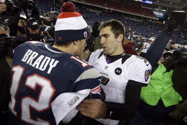 New England Patriots quarterback Tom Brady (12) meets with Baltimore Ravens quarterback Joe Flacco (5) after the NFL football AFC Championship football game in Foxborough, Mass., Sunday, Jan. 20, 2013. The Ravens won 28-13 to advance to Super Bowl XLVII. (AP Photo/Steven Senne)