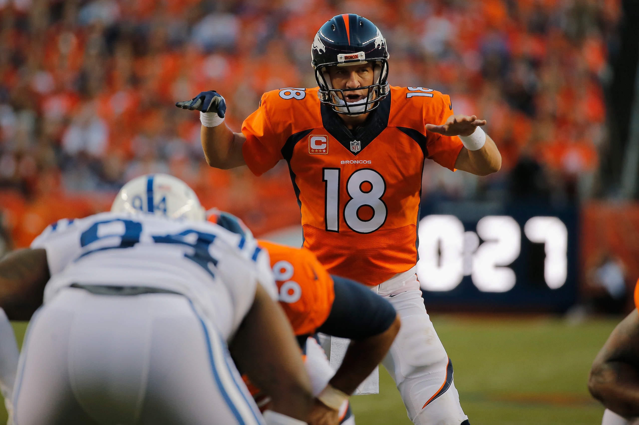 DENVER, CO - SEPTEMBER 07:  Quarterback Peyton Manning #18 of the Denver Broncos runs the offense against the Indianapolis Colts at Sports Authority Field at Mile High on September 7, 2014 in Denver, Colorado. The Broncos defeated the Colts 31-24.  (Photo by Doug Pensinger/Getty Images)
