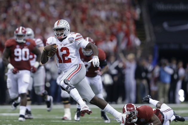 Ohio State quarterback Cardale Jones (12) runs down field against Alabama in the first half of the Sugar Bowl NCAA college football playoff semifinal game, Thursday, Jan. 1, 2015, in New Orleans. (AP Photo/Brynn Anderson)