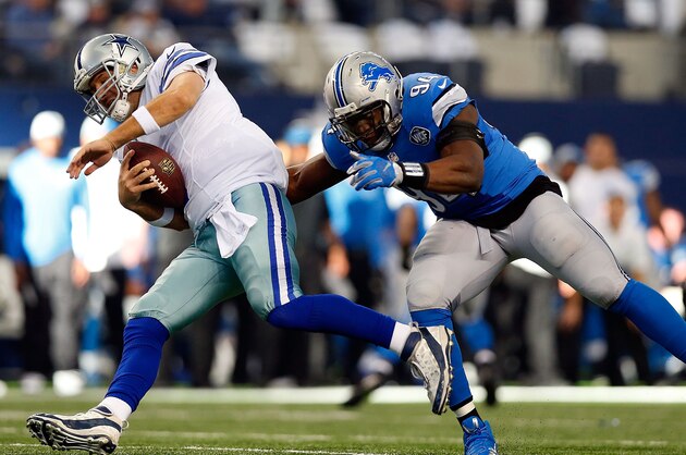 ARLINGTON, TX - JANUARY 04: Tony Romo #9 of the Dallas Cowboys tries to escape the rush of Ezekiel Ansah #94 of the Detroit Lions during the first half of their NFC Wild Card Playoff game at AT&T Stadium on January 4, 2015 in Arlington, Texas. (Photo by Tom Pennington/Getty Images) ARLINGTON, TX - JANUARY 04: Tony Romo #9 of the Dallas Cowboys tries to escape the rush of Ezekiel Ansah #94 of the Detroit Lions during the first half of their NFC Wild Card Playoff game at AT&T Stadium on January 4, 2015 in Arlington, Texas. (Photo by Tom Pennington/Getty Images)