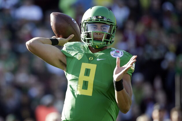 Oregon quarterback Marcus Mariota prepares to throw against Florida State during the first half of the Rose Bowl NCAA college football playoff semifinal, Thursday, Jan. 1, 2015, in Pasadena, Calif. (AP Photo/Jae C. Hong)