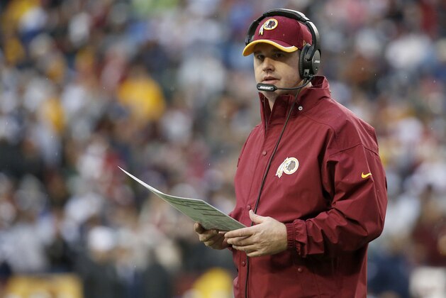 Washington Redskins head coach Jay Gruden watches the action from the sidelines during the second half of an NFL football game against the Dallas Cowboys in Landover, Md., Sunday, Dec. 28, 2014. (AP Photo/Alex Brandon)
