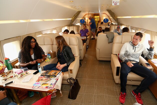 SINGAPORE - DECEMBER 01:  Tomas Berdych,Serena Williams and Daniela Hantuchova of the Singapore Slammers on a private jet from Manila to Singapore  prior to the Coca-Cola International Premier Tennis League at the Singapore Sports Hub on December 1, 2014 in Singapore, .  (Photo by Clive Brunskill/Getty Images for IPTL 2014