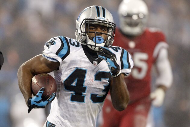 Carolina Panthers' Fozzy Whittaker (43) runs for a touchdown against the Arizona Cardinals in the second half of an NFL wild card playoff football game in Charlotte, N.C., Saturday, Jan. 3, 2015. (AP Photo/Bob Leverone)