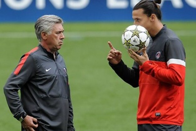 PSG's Zlatan Ibrahimovic, right, from Sweden talks with his coach Carlo Ancelotti, from Italy, during a training session at the Dragao stadium, in Porto, Portugal, Tuesday, Oct. 2, 2012. PSG will play FC Porto in a Champions League group A soccer match on Wednesday. (AP Photo/Paulo Duarte)