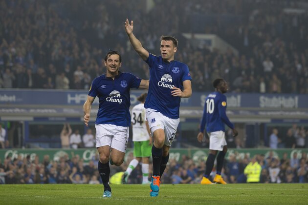 Everton's Seamus Coleman, center, celebrates alongside teammate Leighton Baines after scoring against Wolfsburg during their Europa League Group H soccer match at Goodison Park Stadium, Liverpool, England, Thursday Sept. 18, 2014. (AP Photo/Jon Super)