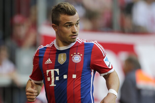 Bayern's Xherdan Shaqiri of Switzerland watches his team mates during the German first division Bundesliga soccer match between FC Bayern and SV Werder Bremen in the Allianz Arena in Munich, Germany, on Saturday, Oct. 18, 2014. (AP Photo/Matthias Schrader)