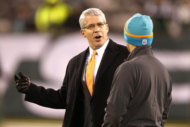 Miami Dolphins general manager Dennis Hickey talks with a Dolphins coach on the field before an NFL football game against the New York Jets, Monday, Dec. 1, 2014, in East Rutherford, N.J. (AP Photo/Kathy Willens)