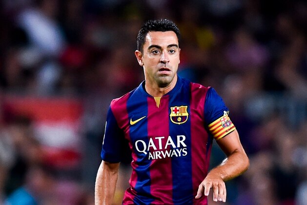 BARCELONA, SPAIN - AUGUST 18:  Xavi Hernandez of FC Barcelona runs with the ball during the Joan Gamper Trophy match between FC Barcelona and Club Leon at Camp Nou on August 18, 2014 in Barcelona, Spain.  (Photo by David Ramos/Getty Images)