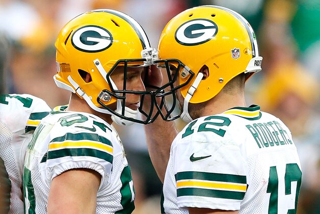 TAMPA, FL - DECEMBER 21:  Aaron Rodgers #12 of the Green Bay Packers reacts with Jordy Nelson #87 after they connected for a touchdown against the Tampa Bay Buccaneers at Raymond James Stadium on December 21, 2014 in Tampa, Florida.  (Photo by Kevin C. Cox/Getty Images)