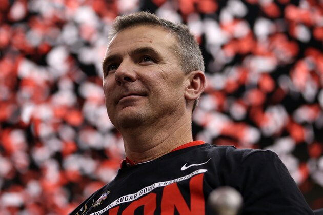 NEW ORLEANS, LA - JANUARY 01:  Head coach Urban Meyer of the Ohio State Buckeyes celebrates with the trophy after defeating the Alabama Crimson Tide in the All State Sugar Bowl at the Mercedes-Benz Superdome on January 1, 2015 in New Orleans, Louisiana.  The Ohio State Buckeyes defeated the Alabama Crimson Tide 42 to 35.  (Photo by Chris Graythen/Getty Images)