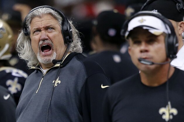 New Orleans Saints defensive coordinator Rob Ryan, left, yells behind head coach Sean Payton, right, in the second half of an NFL football game in New Orleans, Sunday, Dec. 21, 2014. (AP Photo/Bill Haber)