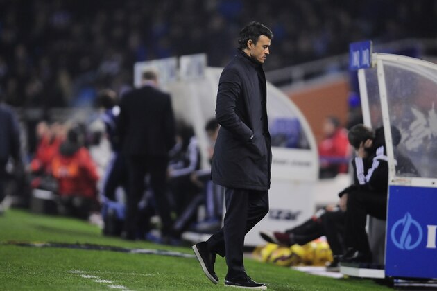 Barcelona’s head coach Luis Enrique, goes to his bench during their La Liga soccer match between Real Sociedad and Barcelona, at Anoeta stadium in San Sebastian, northern Spain, Sunday, Jan.4, 2015. Barcelona lost the match 1-0. (AP Photo/Alvaro Barrientos)