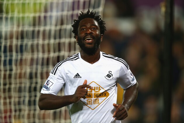 SWANSEA, WALES - OCTOBER 25:  Wilfried Bony of Swansea City celebrates scoring their second goal during the Barclays Premier League match between Swansea City and Leicester City at Liberty Stadium on October 25, 2014 in Swansea, Wales.  (Photo by Clive Rose/Getty Images)