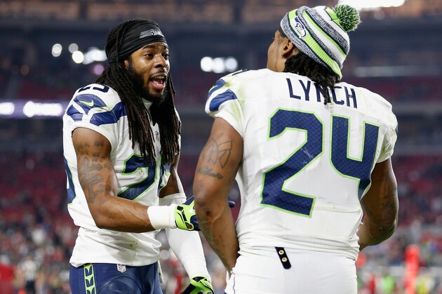 GLENDALE, AZ - DECEMBER 21:  Cornerback Richard Sherman #25 (L) of the Seattle Seahawks talks with running back Marshawn Lynch #24 during the NFL game against the Arizona Cardinals at the University of Phoenix Stadium on December 21, 2014 in Glendale, Arizona.  The Seahawks defeated the Cardinals 35-6.  (Photo by Christian Petersen/Getty Images)