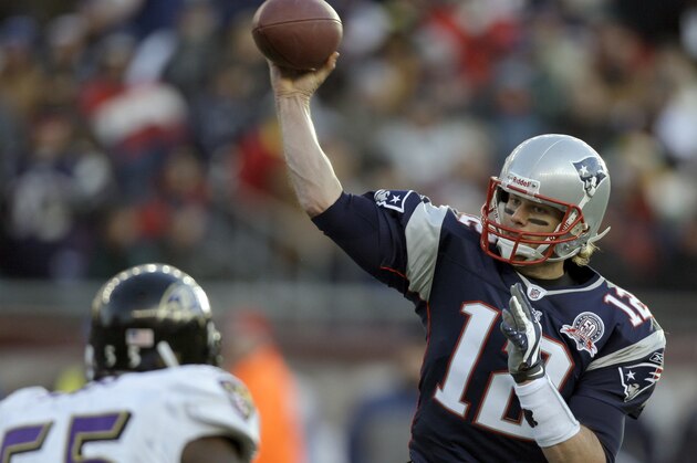 New England Patriots quarterback Tom Brady (12) looks to pass under pressure from Baltimore Ravens linebacker Terrell Suggs (55) during the second half of an NFL wild-card playoff football game in Foxborough, Mass., Sunday, Jan. 10, 2010. (AP Photo/Charles Krupa)