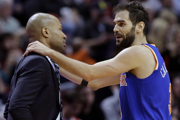New York Knicks guard Jose Calderon (3) talks with head coach Derek Fisher during the second half of an NBA basketball game against the Chicago Bulls in Chicago on Thursday, Dec. 18, 2014. The Bulls won 103-97. (AP Photo/Nam Y. Huh)