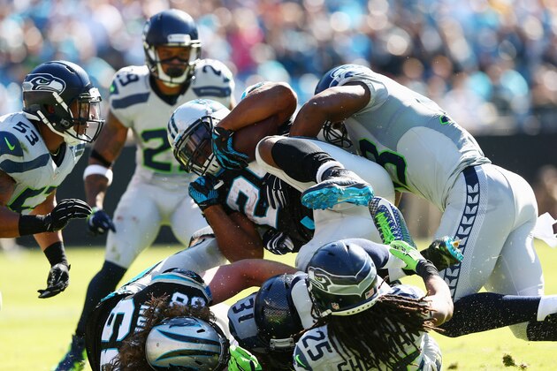 CHARLOTTE, NC - OCTOBER 26:  Jonathan Stewart #28 of the Carolina Panthers runs the ball against the Seattle Seahawks in the 1st half during the game at Bank of America Stadium on October 26, 2014 in Charlotte, North Carolina.  (Photo by Streeter Lecka/Getty Images)
