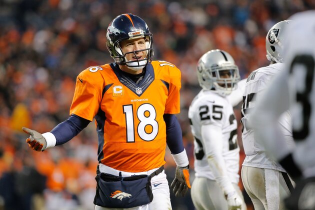 DENVER, CO - DECEMBER 28:  Quarterback Peyton Manning #18 of the Denver Broncos protests the spot of the football on a call that would be reviewed and changed to a first down ruling during a game against the Oakland Raiders at Sports Authority Field at Mile High on December 28, 2014 in Denver, Colorado.  (Photo by Doug Pensinger/Getty Images)