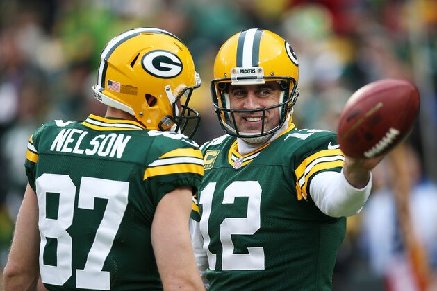 GREEN BAY, WI - DECEMBER 28:  Aaron Rodgers #12 of the Green Bay Packers reacts in the first quarter against the Detroit Lions at Lambeau Field on December 28, 2014 in Green Bay, Wisconsin.  (Photo by Chris Graythen/Getty Images)