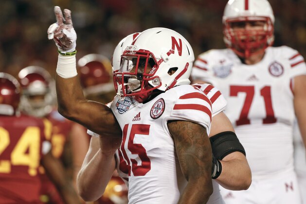Nebraska wide receiver De'Mornay Pierson-El salutes the crowd during his celebration of a 9-yard touchdown reception against Southern California during the first half of the Holiday Bowl NCAA college football game Saturday, Dec. 27, 2014, in San Diego. (AP Photo/Lenny Ignelzi)