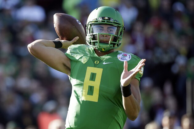 Oregon quarterback Marcus Mariota prepares to throw against Florida State during the first half of the Rose Bowl NCAA college football playoff semifinal, Thursday, Jan. 1, 2015, in Pasadena, Calif. (AP Photo/Jae C. Hong)