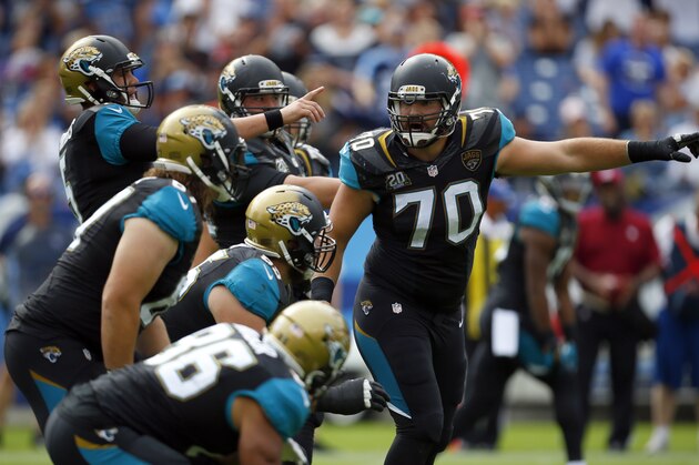 Jacksonville Jaguars center Luke Bowanko (70) yells out assignments before he snaps the ball against the Tennessee Titans during an NFL football game Sunday, Oct. 12, 2014, in Nashville, Tenn.  (Jeff Haynes/AP Images for Panini)