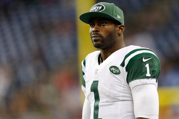 DETROIT, MI - NOVEMBER 24: Michael Vick #1 of the New York Jets looks on after their loss of 3-38 to the Buffalo Bills at Ford Field on November 24 , 2014 in Detroit, Michigan. (Photo by Leon Halip/Getty Images)