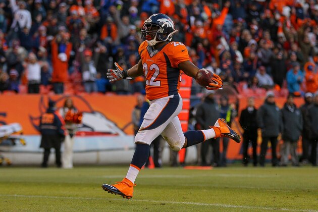 DENVER, CO - DECEMBER 28:  Running back C.J. Anderson #22 of the Denver Broncos rushes for a third quarter rushing touchdown against the Oakland Raiders (his third of the game) at Sports Authority Field at Mile High on December 28, 2014 in Denver, Colorado.  (Photo by Justin Edmonds/Getty Images)