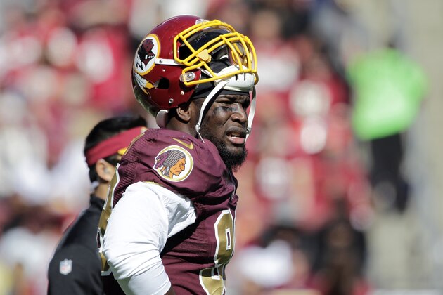 FILE - In this Oct. 19, 2014, file photo, Washington Redskins outside linebacker Brian Orakpo (98) pauses on the field during the first half of an NFL football game against the Tennessee Titans in Landover, Md. Redskins coach Jay Gruden says linebacker Brian Orakpo is done for the season because of a torn right pectoral muscle. Gruden says Monday, Oct. 20, 2014,  that Orakpo needs surgery. (AP Photo/Mark E. Tenally, File)