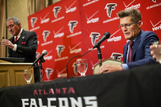 Atlanta Falcons general manager Thomas Dimitroff, right, speaks at a news conference announcing that Mike Smith has been fired as head coach of the football team as owner Arthur Blank, left, listens, Monday, Dec. 29, 2014, in Atlanta. (AP Photo/David Goldman)
