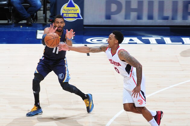 ATLANTA, GA - JANUARY 7: Jeff Teague #0 of the Atlanta Hawks steals the ball from Mike Conley #11 of the Memphis Grizzlies on January 7, 2015 at Philips Arena in Atlanta, Georgia.  NOTE TO USER: User expressly acknowledges and agrees that, by downloading and/or using this Photograph, user is consenting to the terms and conditions of the Getty Images License Agreement. Mandatory Copyright Notice: Copyright 2015 NBAE (Photo by Scott Cunningham/NBAE via Getty Images)