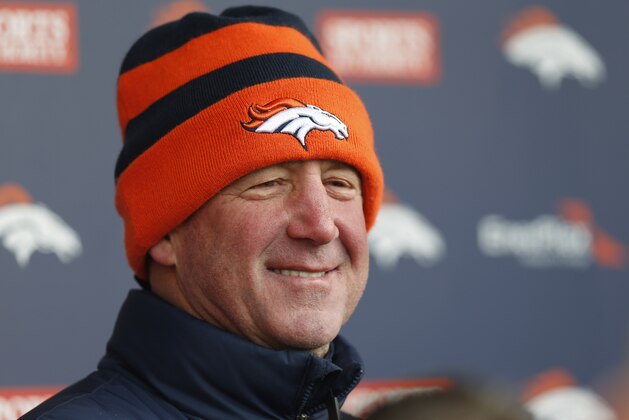 Denver Broncos head coach John Fox smiles as he responds to question after practice for NFL football divisional playoff game against the Indianapolis Colts Wednesday, Jan. 7, 2015, in Englewood, Colo. (AP Photo/David Zalubowski)