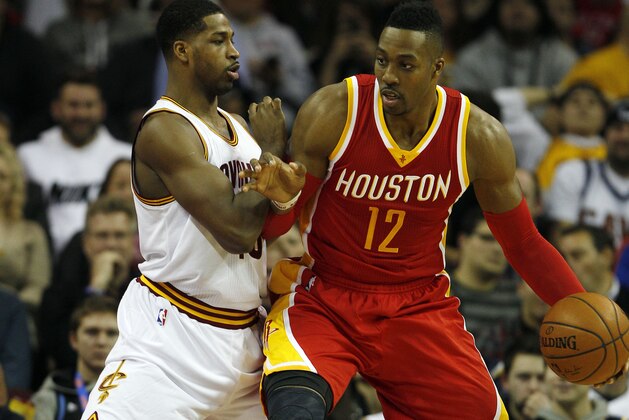 CLEVELAND, OH - JANUARY 7:  Tristan Thompson #13 of the Cleveland Cavaliers defends against Dwight Howard #12 of the Houston Rockets during the first half of their game on January 7, 2015 at Quicken Loans Arena  in Cleveland, Ohio. NOTE TO USER: User expressly acknowledges and agrees that, by downloading and or using this photograph, User is consenting to the terms and conditions of the Getty Images License Agreement. (Photo by David Maxwell/Getty Images)