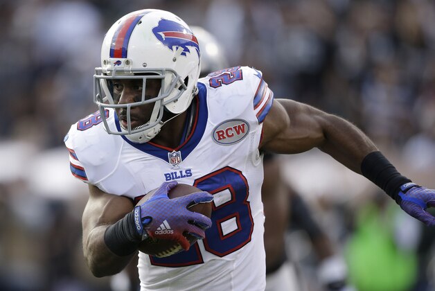 Buffalo Bills running back C.J. Spiller (28) runs against the Oakland Raiders during the second quarter of an NFL football game in Oakland, Calif., Sunday, Dec. 21, 2014. (AP Photo/Marcio Jose Sanchez)