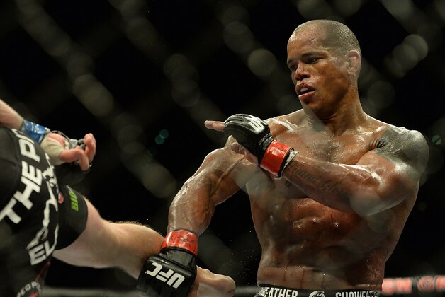 Jan 3, 2015; Las Vegas, NV, USA; Hector Lombard (red gloves) and Josh Burkman (blue gloves) compete in their welterweight bout at UFC 182 at MGM Grand Garden Arena. Lombard won. Mandatory Credit: Jayne Kamin-Oncea-USA TODAY Sports