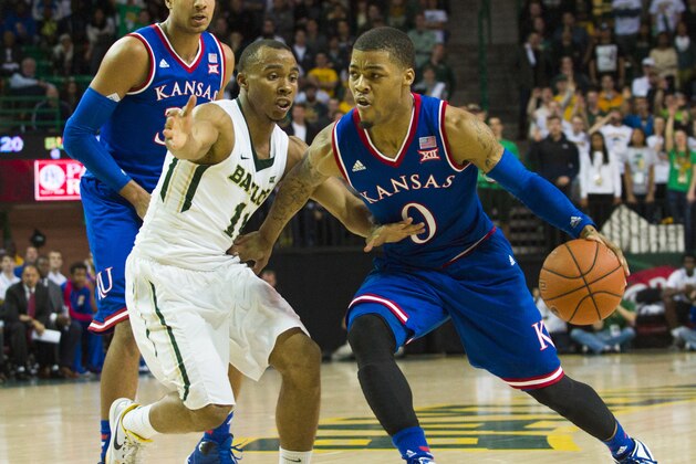 WACO, TX - JANUARY 7: Frank Mason III #0 of the Kansas Jayhawks drives to the basket against Lester Medford #11 of the Baylor Bears on January 7, 2015 at the Ferrell Center in Waco, Texas.  (Photo by Cooper Neill/Getty Images)