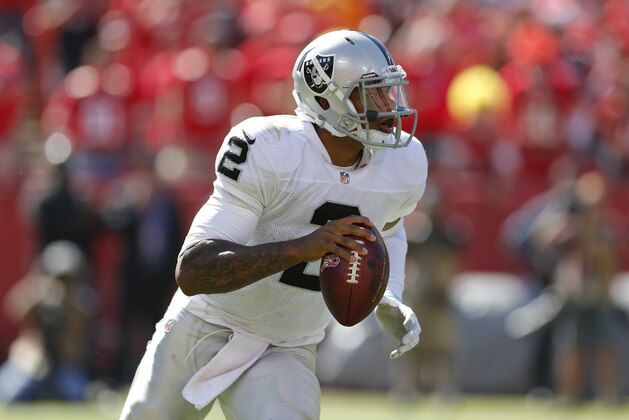 Oakland Raiders quarterback Terrelle Pryor (2) looks to pass during the first half of an NFL football game against the Kansas City Chiefs at Arrowhead Stadium in Kansas City, Mo., Sunday, Oct. 13, 2013. (AP Photo/Ed Zurga)