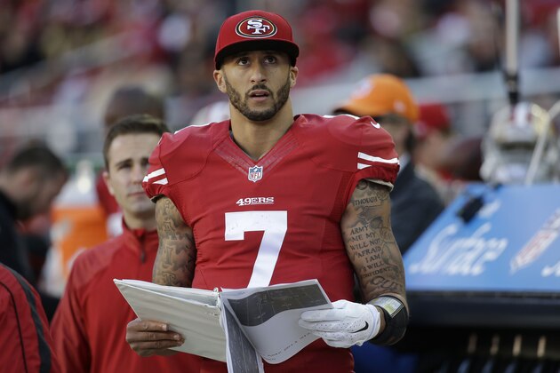San Francisco 49ers quarterback Colin Kaepernick (7) stands on the sideline during the third quarter of an NFL football game against the Arizona Cardinals in Santa Clara, Calif., Sunday, Dec. 28, 2014. (AP Photo/Marcio Jose Sanchez)