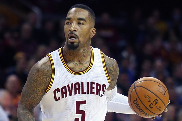 Jan 7, 2015; Cleveland, OH, USA; Cleveland Cavaliers guard J.R. Smith (5) looks to pass against the Houston Rockets during the first quarter at Quicken Loans Arena. Mandatory Credit: Ron Schwane-USA TODAY Sports