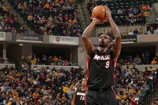 INDIANAPOLIS, IN - DECEMBER 31:  Luol Deng #9 of the Miami Heat shoots a free throw against the Indiana Pacers during the game on December 31, 2014 at Bankers Life Fieldhouse in Indianapolis, Indiana. NOTE TO USER: User expressly acknowledges and agrees that, by downloading and or using this Photograph, user is consenting to the terms and conditions of the Getty Images License Agreement. Mandatory Copyright Notice: Copyright 2014 NBAE (Photo by Ron Hoskins/NBAE via Getty Images)