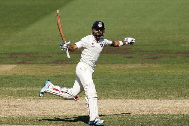 SYDNEY, AUSTRALIA - JANUARY 08:  Virat Kohli of India celebrates and acknowledges the crowd after scoring a century during day three of the Fourth Test match between Australia and India at Sydney Cricket Ground on January 8, 2015 in Sydney, Australia.  (Photo by Matt King/Getty Images)